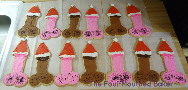 On the 13th day of Jeebus' birthday, my baker gave to me: 13 cock cookies wearing lil' Santa hats on their heads.